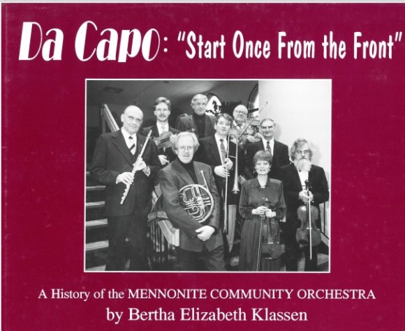 The cover of "Da Capo: 'Start Once From the Front', A History of the Mennonite Community Orchestra" by Bertha Elizabeth Klassen. A group of past MCO conductors, pictured in 1992, is on the cover.